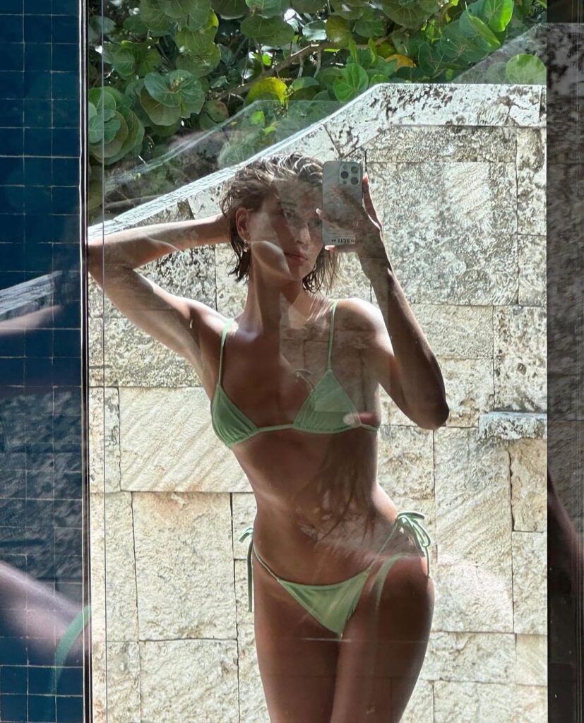 Hailey Bieber shows two-piece green string bikini from Tropic Of C