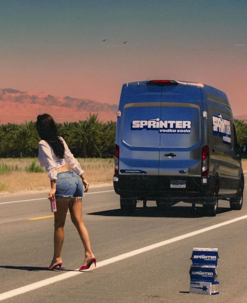 Jenner was photographed stopping a bright blue Sprinter van on the side of the road