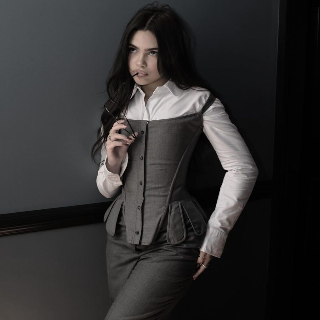 Ariana Greenblatt wearing black and white dress